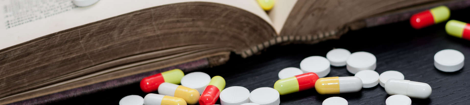 medicines and an open book